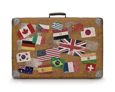 Antique suitcase with stamps flags representing each country traveled. Clipping path included.
