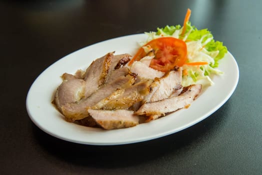 Roasted pork on the table in the restaurant.