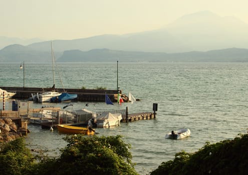 Small harbour at italian lake in the morning