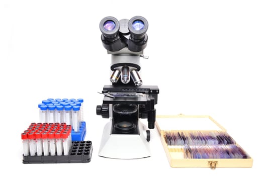 microscope with laboratory equipment on white background