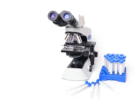 microscope with laboratory equipment on white background
