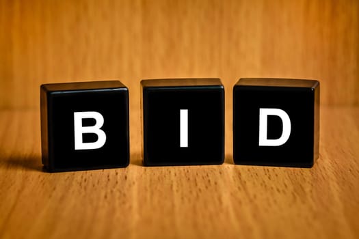 bid text on black block, business concept