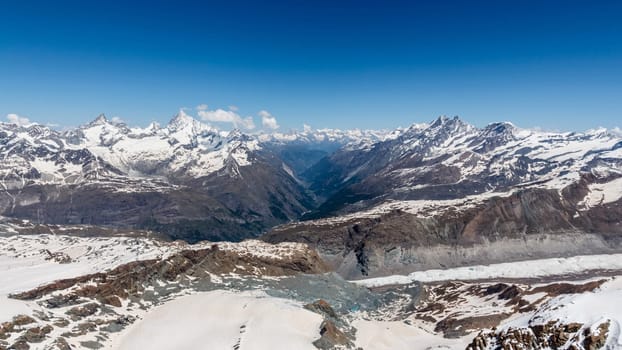 Snow Mountain Range Landscape with Blue Sky at Alps Region, Zermatt, Switzerland