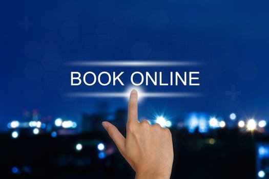 hand clicking book online button on a touch screen interface