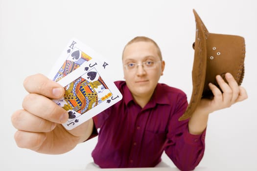 Man holding hat and two cards