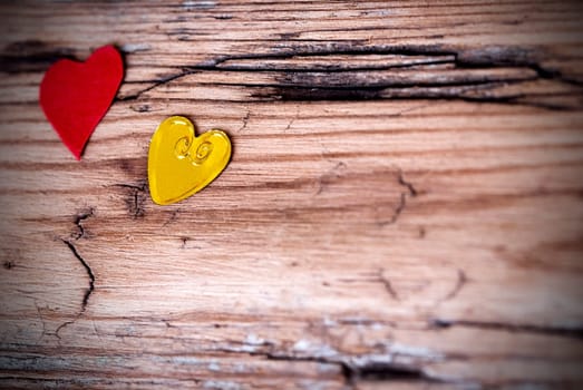 Heart Background with Two different Hearts on a Wooden Plank