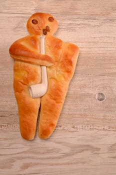 Raising bread man on a rustic wooden background
