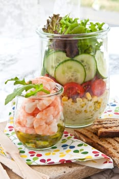 Various layered salads with fresh muese in the mason jar