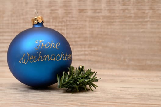 Blue Christmas bauble with golden font