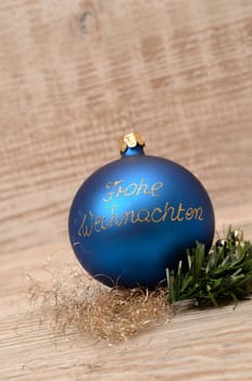 Blue Christmas bauble with golden font