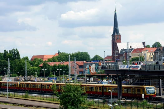 Berlin,Germany – June 16,2014: A crowd crosses the bridge of the Berlin Friedrichshain S-Bahn station on June 16,2014 in Berlin.