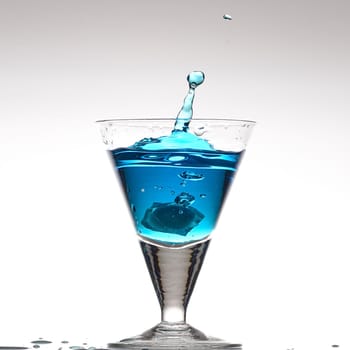 Splashing blue cocktail