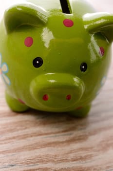 Closeup of a green piggy bank