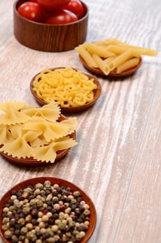 Pasta ingredients on a wooden table