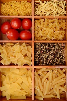 Old wooden box with pasta ingredients