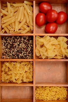 Old wooden box with pasta ingredients