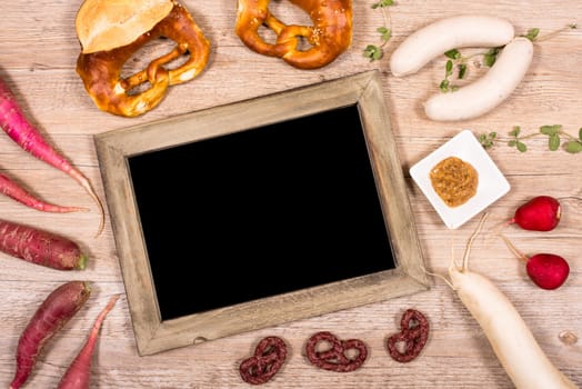 Table with text clearance and white sausage,radish and pretzels