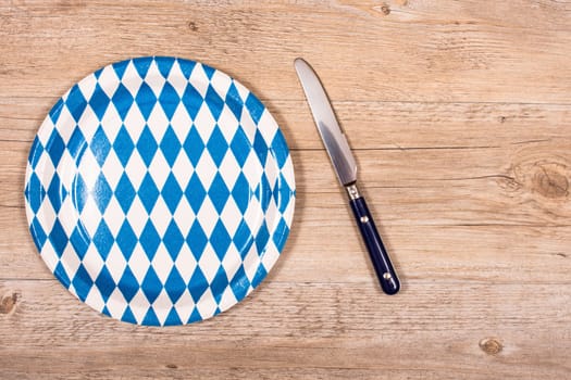 Bavarian bread with knife and plate in blue and white