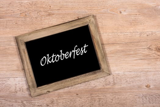 Black black board with wooden with text Oktoberfest
