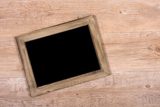 Black wooden black board on a table with text clearance