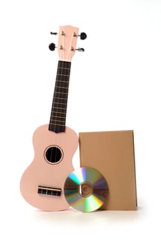 Ukulele with a book and a CD, Learning Concept