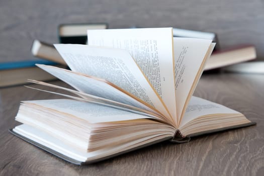 books on wooden deck tabletop