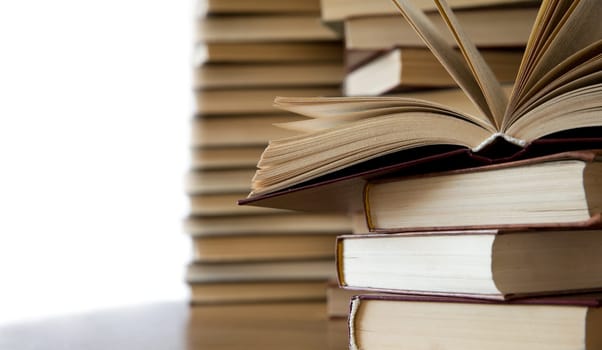 books on wooden deck tabletop