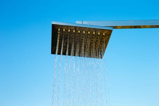 Tropical refreshing shower under sky
