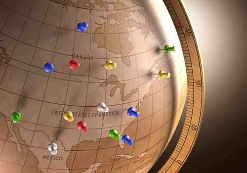 Antique globe with nails marking the travel route.