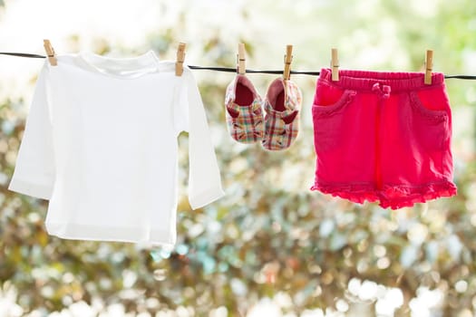 Old photo of baby clothes hanging on the clothesline