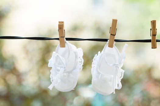 Old photo of baby clothes hanging on the clothesline