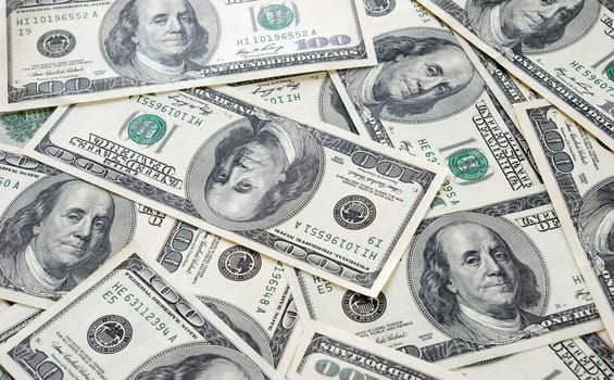 american dollars arranged at the background