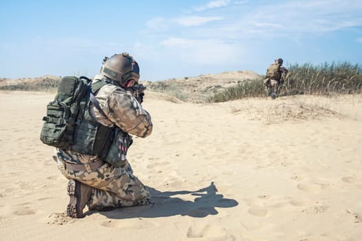 Two soldiers in the desert during the military operation