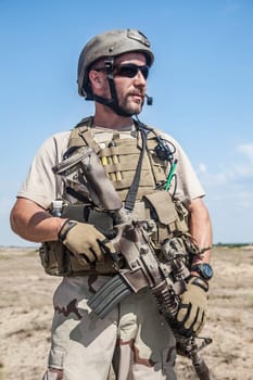 Bearded SEAL team member in the desert
