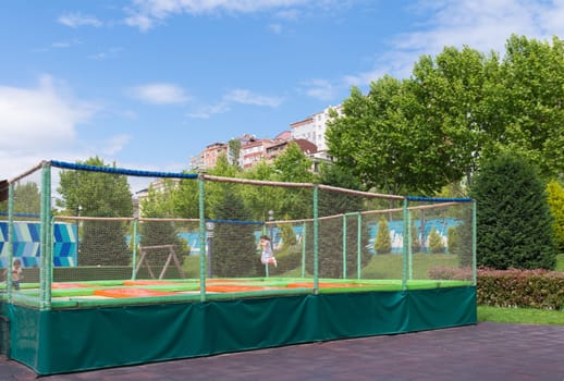 children having fun on some trampolines