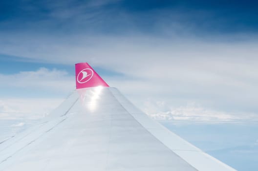 wing tip of a turkish airlines plane in flight. In 2014, Turkish Airlines has been chosen for the fourth time in a row as the best airline in Europe