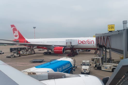 air berlin boeing being loaded at dusseldorf airport. Air Berlin is a low-cost carrier that transports passengers at lower prices to European cities and sunny holiday destinations