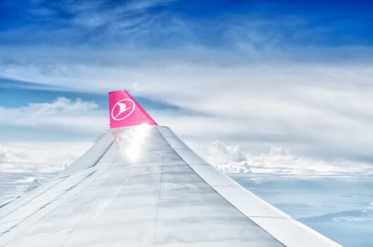 wing tip of a turkish airlines plane in flight. In 2014, Turkish Airlines has been chosen for the fourth time in a row as the best airline in Europe