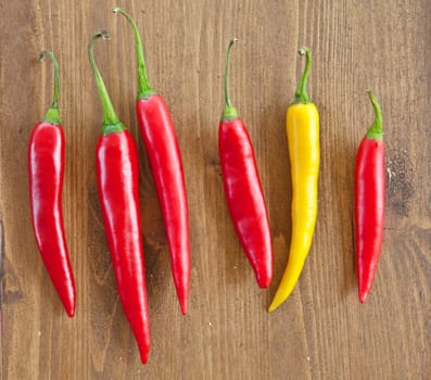 Fresh colorful pods on background made of rustic wood