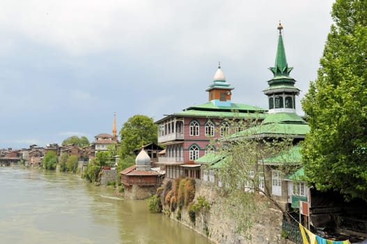 Mosques along the Jahelum river in Srinagar old town, Kashmir, India