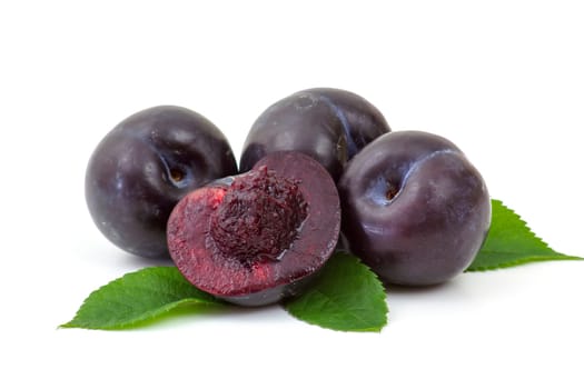 fresh plums on white background