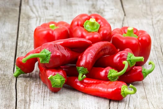red peppers on wooden background