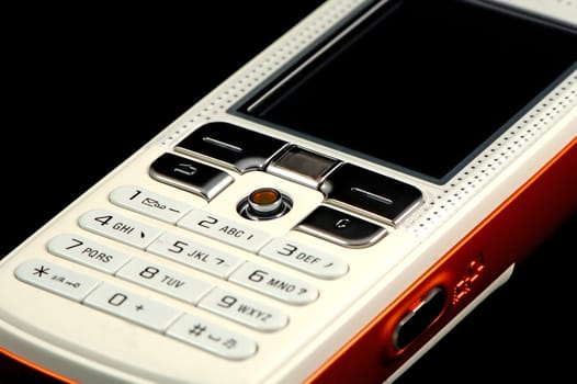 Close up of modern mobile phone over black