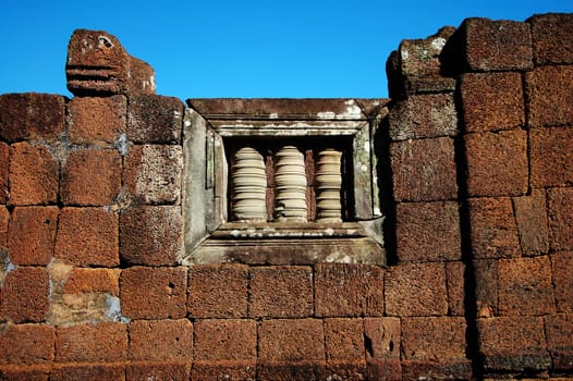 Window of an ancient stone wall in Angkor temple