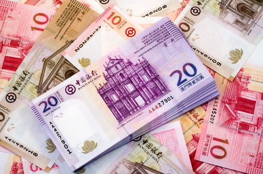 The stack of Macau Patacas (notes) and background