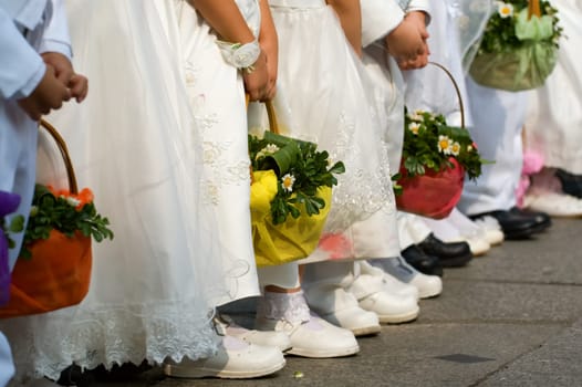 Line of flower girls on wedding day