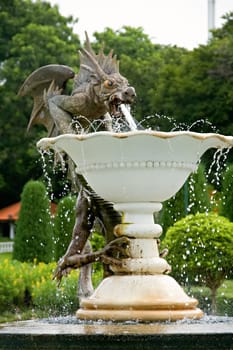 Close up of stone fountain of devil