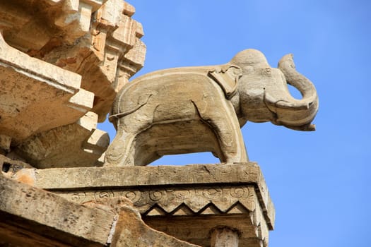 Stone elephant in saluting posture on the exterior of Vijay Sthambh (Victory Tower) viewed from  stairs inside tower, Chittorgarh Fort, Rajasthan, India, Asia