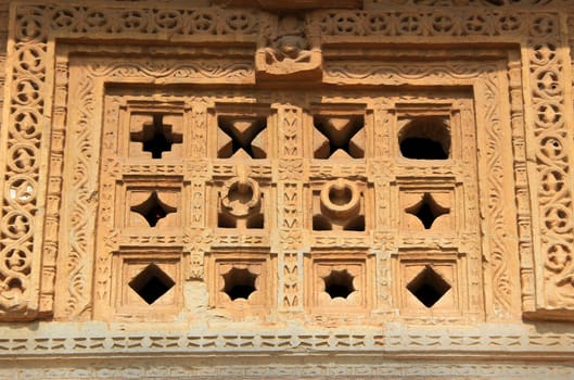 Holes of different geometrical pattern in stone window at Vijay Sthambh (Victory Tower), Chittorgarh Fort, Rajasthan, India, Asia