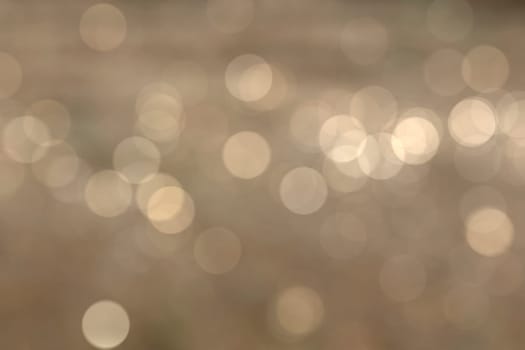 Abstract circular natural light orange bokeh background